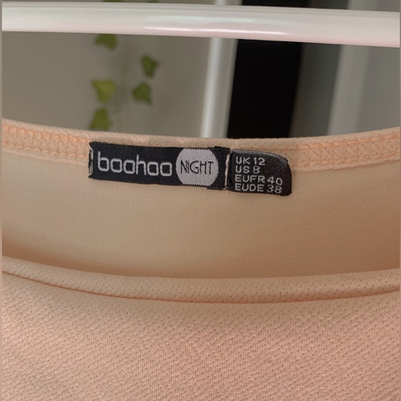 I am selling a light peach dress with straps. - Picture 2 of 3